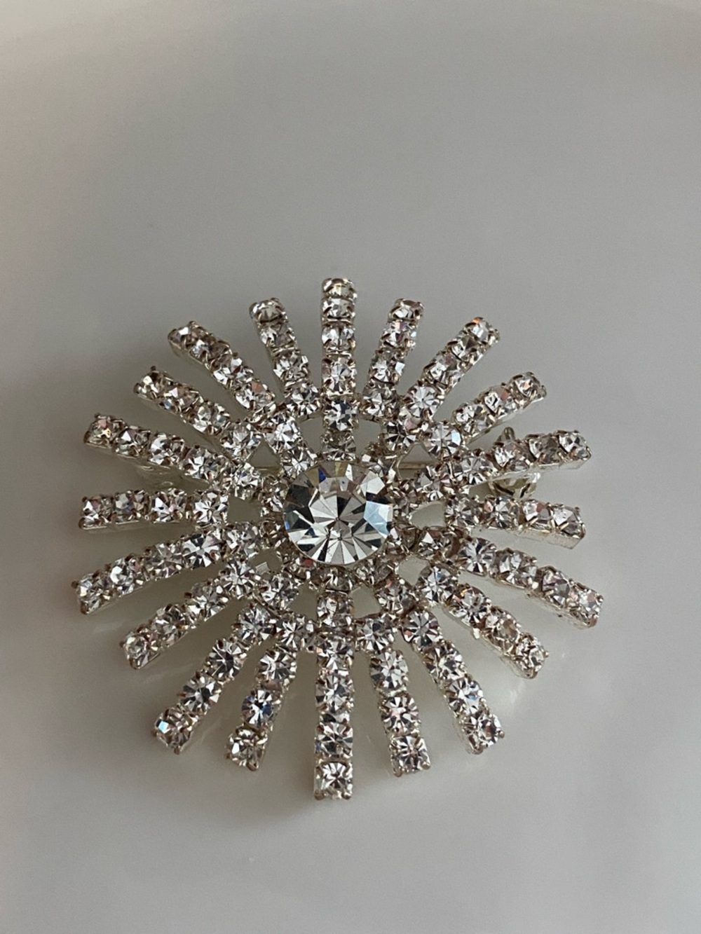 Radiant Silver Crystal Sunburst Brooch - Sparkling Rhinestone Pin